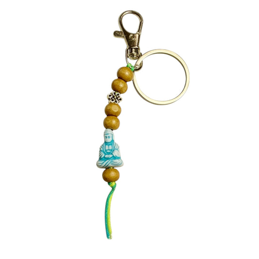 Mediterende boeddha sleutelhanger blauw
