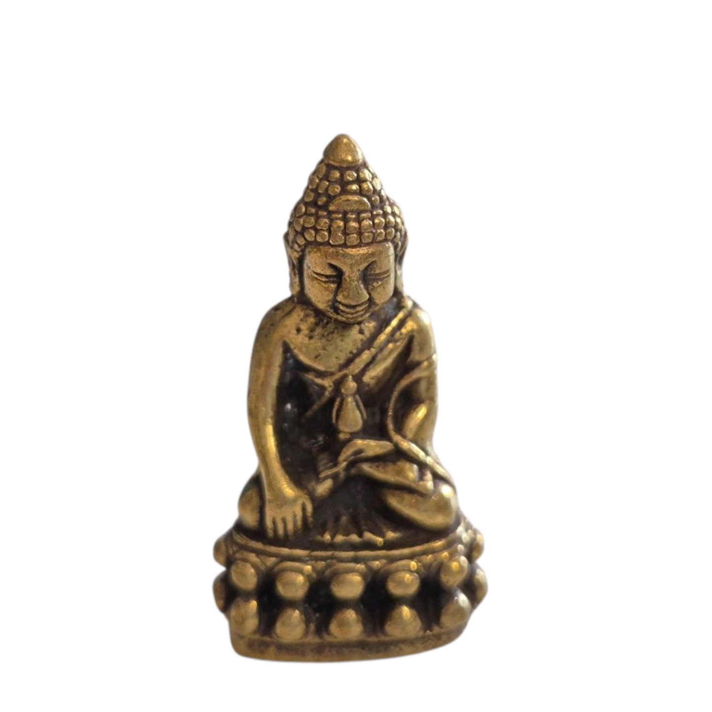 Thaise boeddha met rijstkorrel